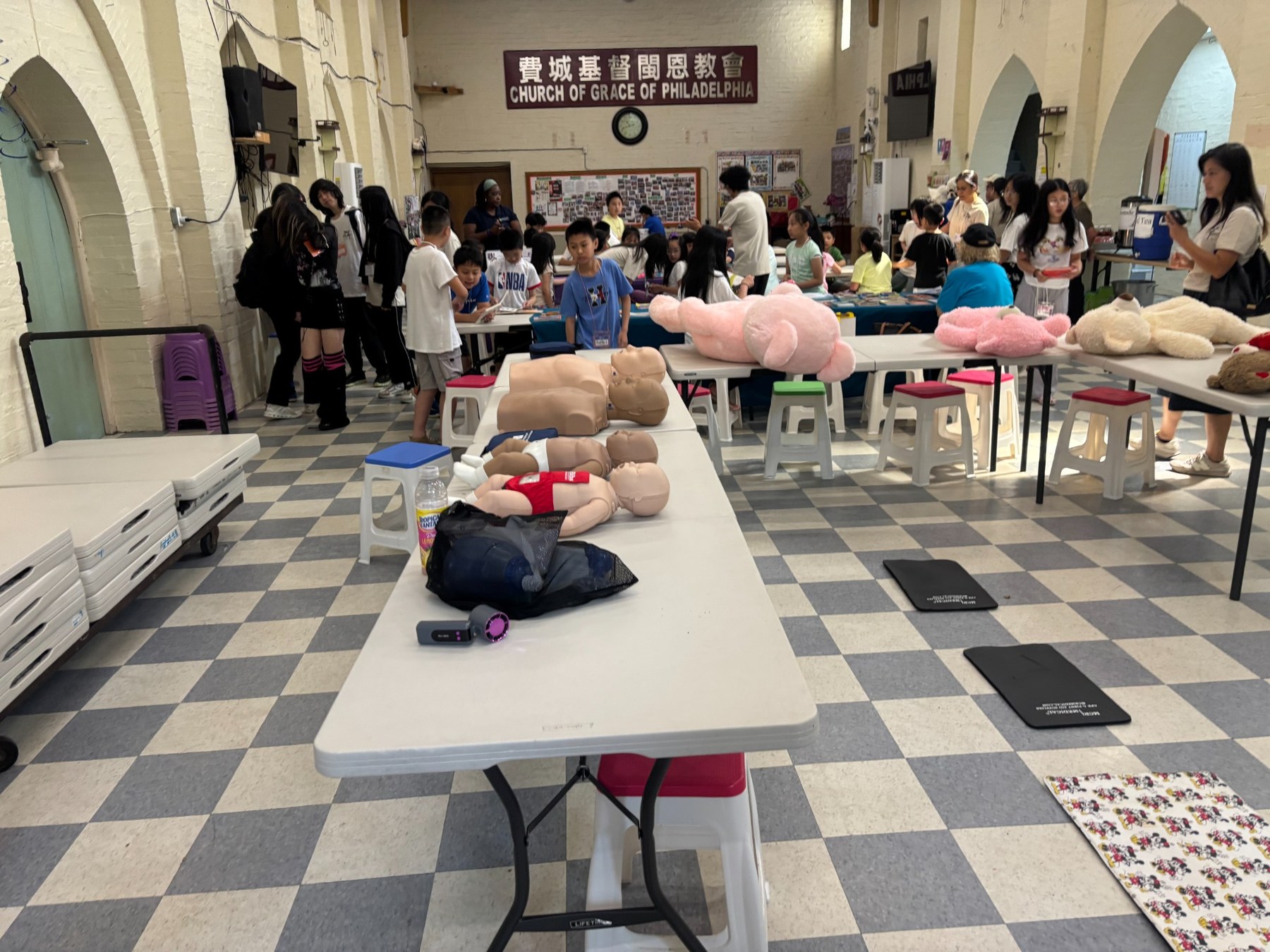Community CPR and preparedness activity inside a busy Philadelphia church hall